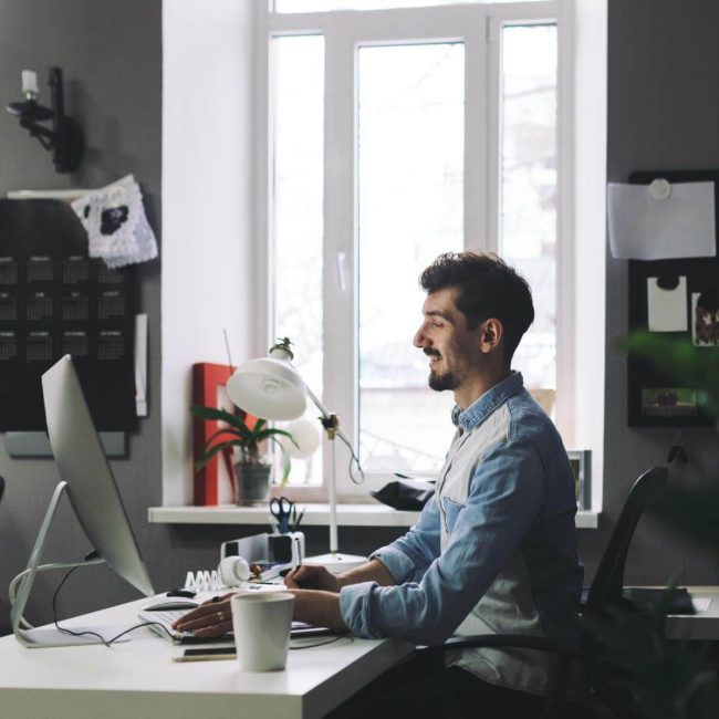 handsome-businessman-working-in-office (1) (1)